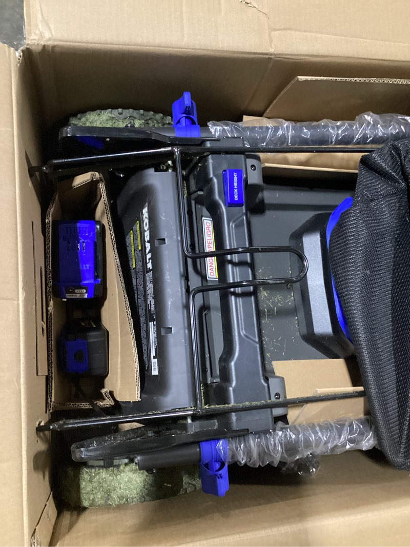 Condition photo showing As Is for kobalt 48v max (24vx2) 21-in push mower kit, (2) 5.0ah batteries and charger included