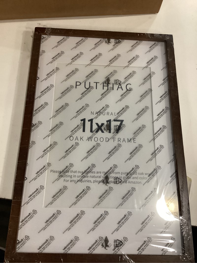 Condition photo showing New/Like New for puthiac 11x17 Walnut Oak Wood Picture Frame - Minimalist 11x17 Poster Frame, 11"x17" Frame Wood, Natural Solid Wooden Picture Frames for Wall Art Photo and Prints (1 Pack, Walnut) Walnut-1P 11x17