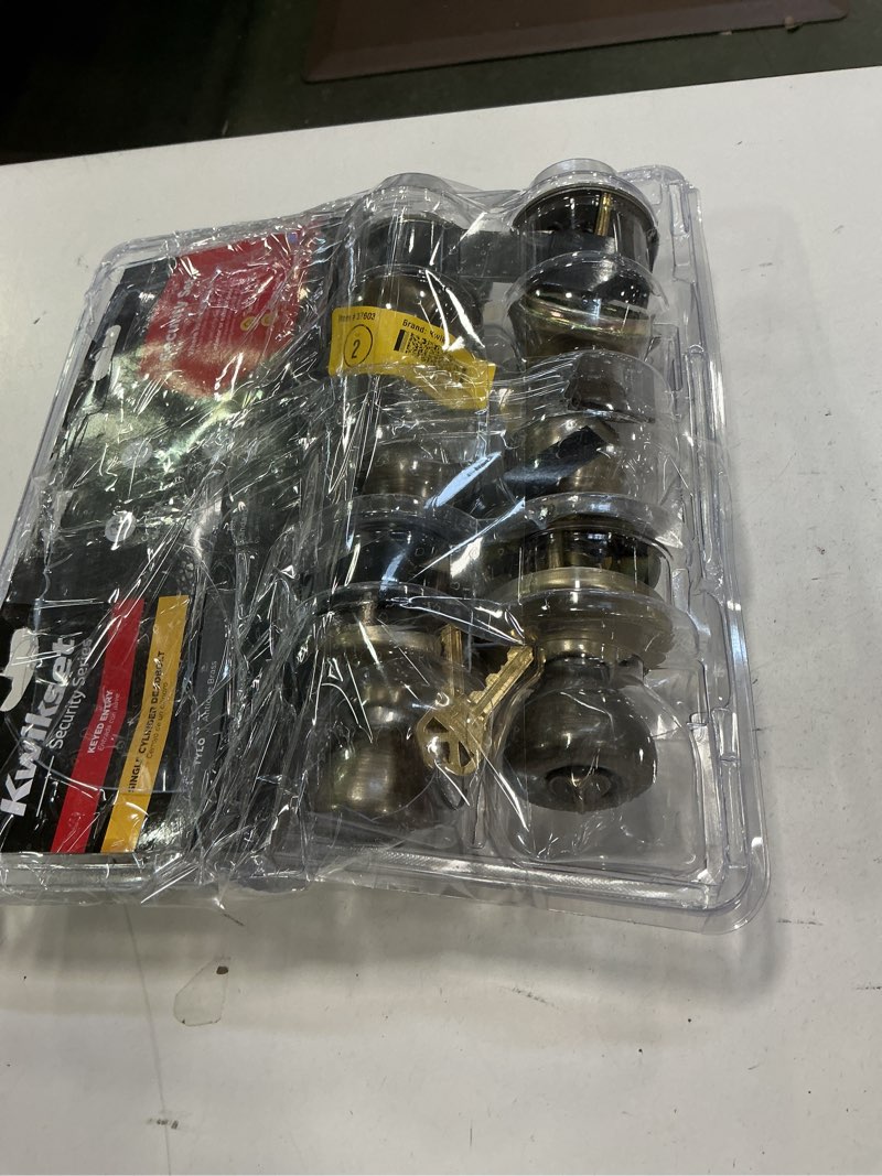 Condition photo showing As Is for Kwikset 242 Tylo Entry Knob and Single Cylinder Deadbolt Project Pack in Antique Brass