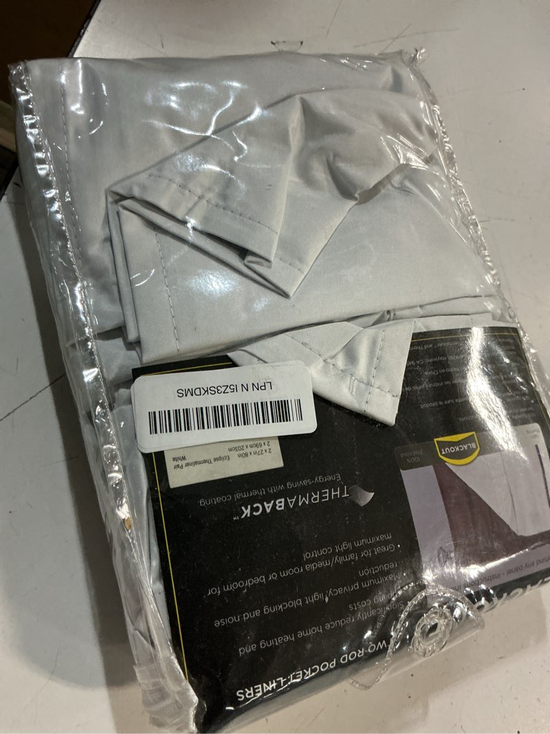 Condition photo showing As Is for ECLIPSE Solid Minimalist Blackout Thermal Liner for Window Curtains with Drapery Hooks (2 Panel Set), 27" x 80", White 27"W x 80"L (Pack of 1)