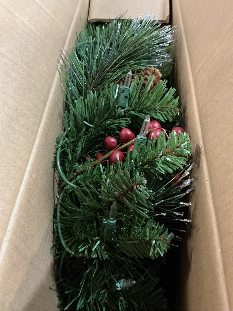 Condition photo showing New/Like New for national tree company 24 in pre-lit crestwood spruce artificial christmas wreath, christmas decoration with glitter, pinecones, red berries, 50 clear lights, 160 tips, green 24 in plug in wreath