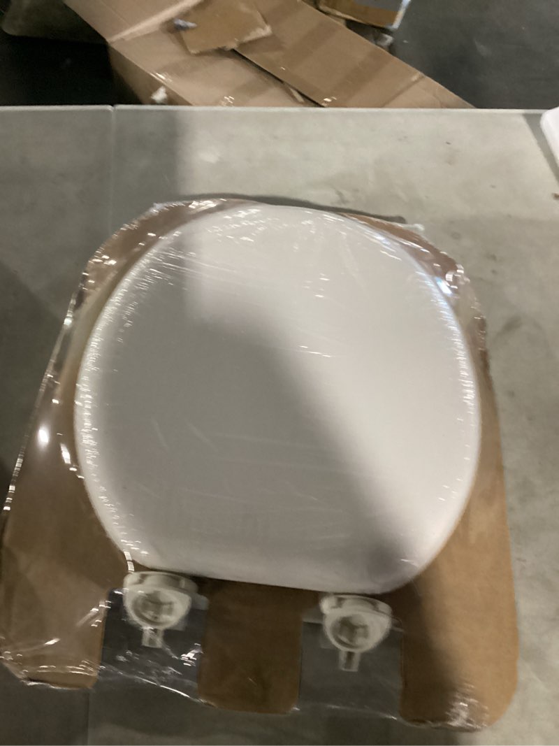 Condition photo showing Good Condition for mayfair padded toilet seat, cushioned soft vinyl over wood core seat, secure hinges, easy clean, made in usa, round, biscuit round biscuit/linen toilet seat
