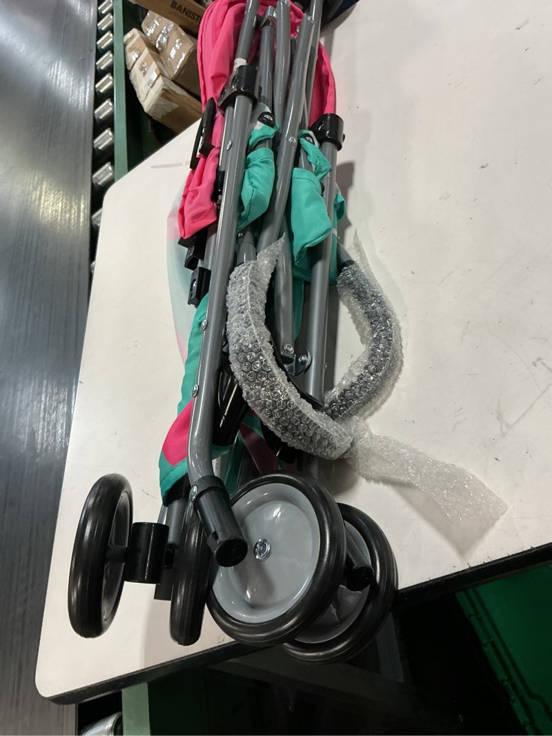 Condition photo showing As Is for cosco character umbrella stroller, easy to store anywhere with its compact umbrella fold, pink flamingo