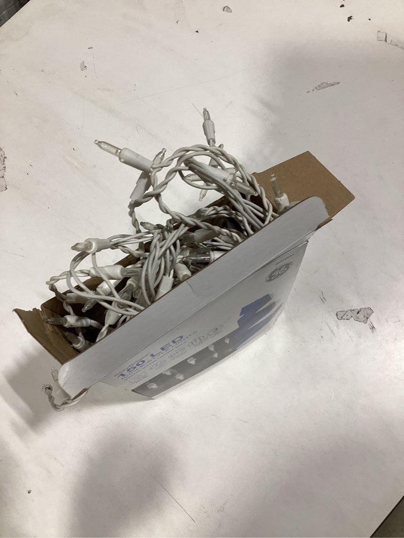 Condition photo showing As Is for GE StayBright 150 -Count Constant White LED Plug-In Christmas Icicle Lights