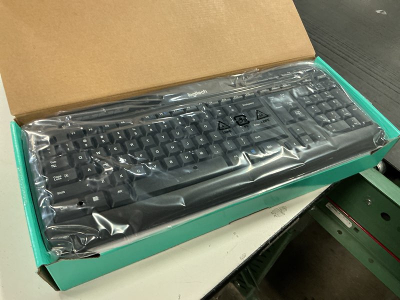 Condition photo showing As Is for Logitech MK335 Quiet Wireless Keyboard and Mouse Combo - Black/Silver Keyboard and Mouse Combo Wireless, Ambidextrous