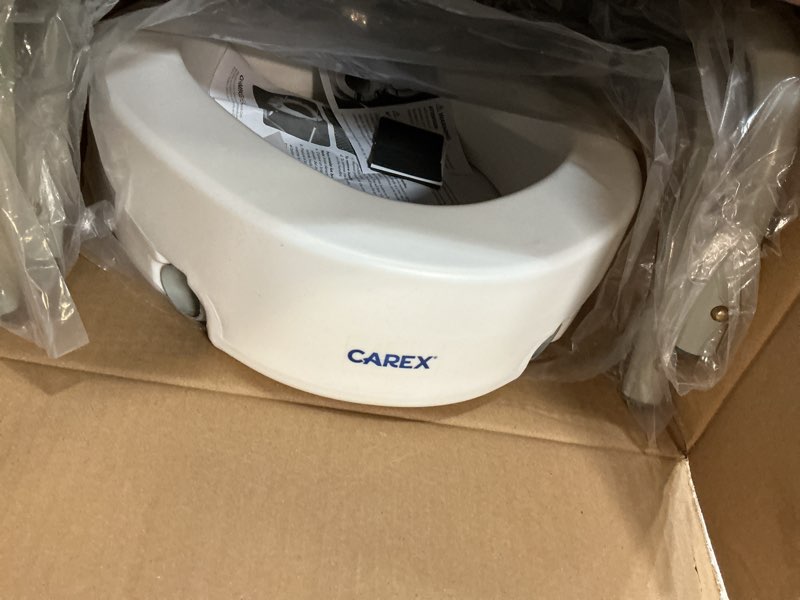 Condition photo showing As Is for Carex 3.5 Inch Raised Toilet Seat with Arms, Elongated Toilet Seat Riser, Up to 250 lbs Capacity, Elevating & Raising Seat for Elderly & Handicap, Universal, Slip-Resistant with Padded Handles, White