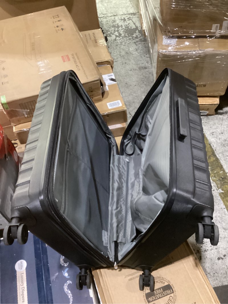 Condition photo showing As Is for amazon basics 30" hardside large checked luggage, hardshell suitcase with wheels, expandable for up to 15% more space, with scratch-resistant surface, four multi-directional wheels, black black large checked