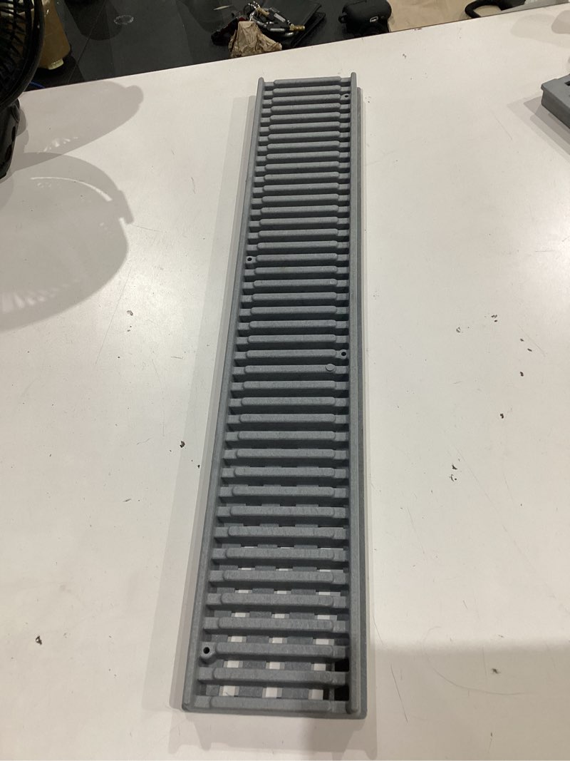 Condition photo showing As Is for spee-d channel 24 in. plastic decorative wave design grate in black