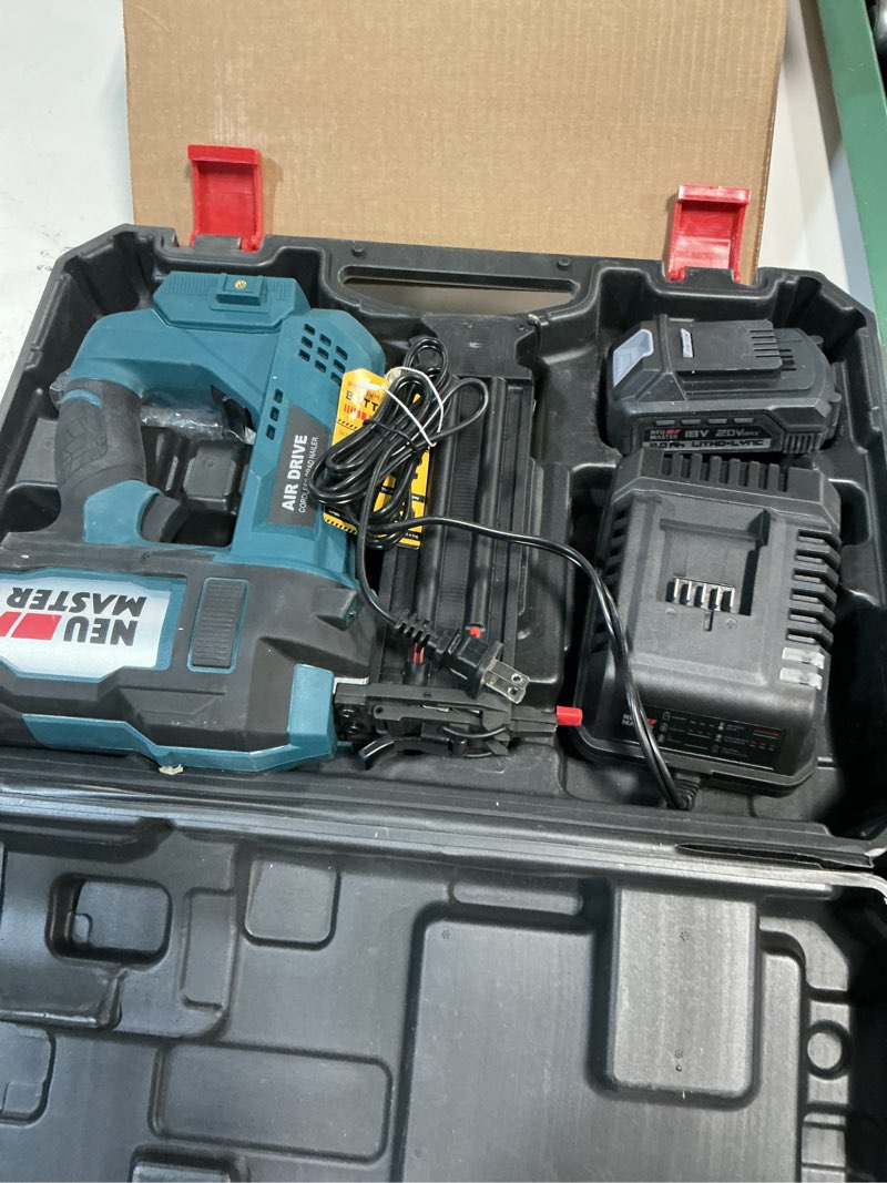 Condition photo showing As Is for NEU MASTER Nail Gun Cordless with Battery Powered - 18 Gauge 2 in 1 Brad Nailer/Staple Gun, 20V Max. 2.0Ah Battery & Charger, 800 Nails & 200 Staples Included Cordless Nail Gun With 20V Max. Battery