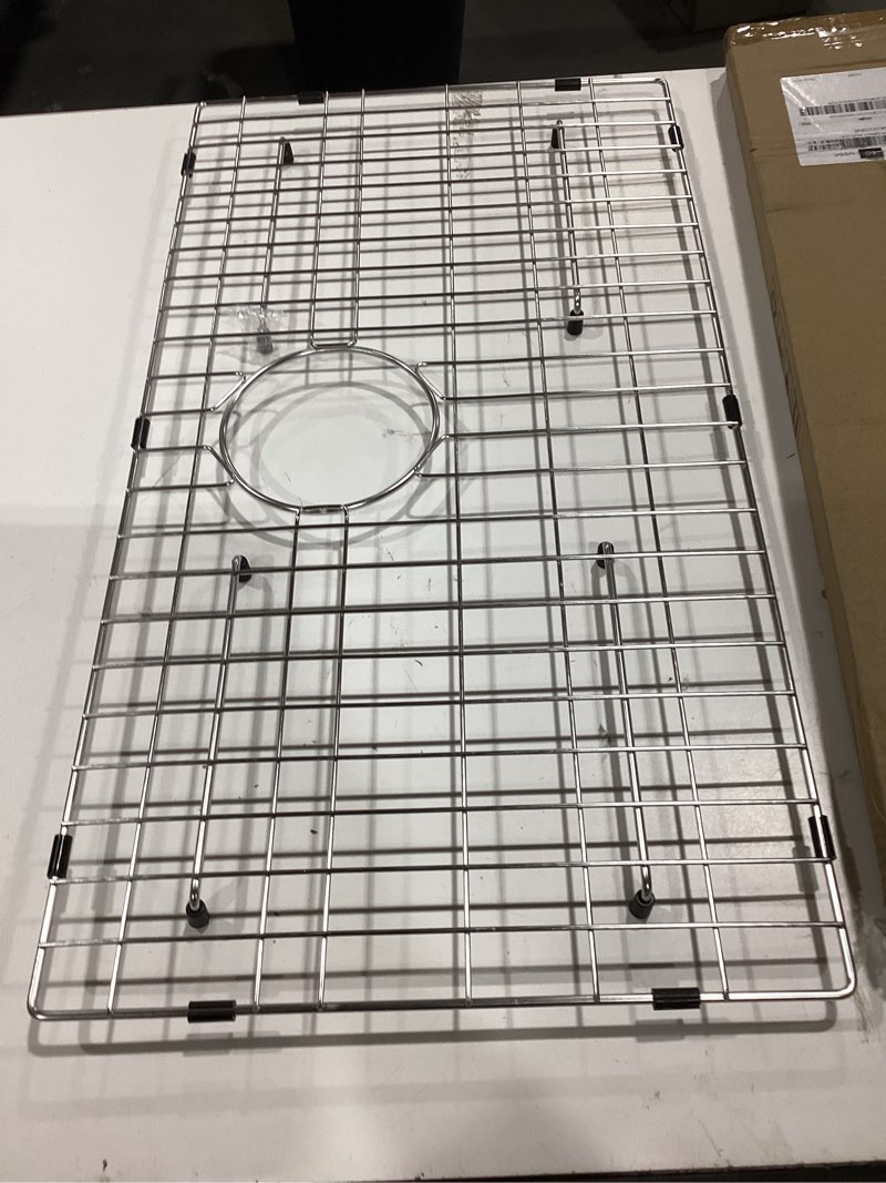 Condition photo showing Good Condition for serene valley sink bottom grid 24-1/8" x 12-5/8", centered drain with corner radius 1-1/2", sink protector nlw2412c