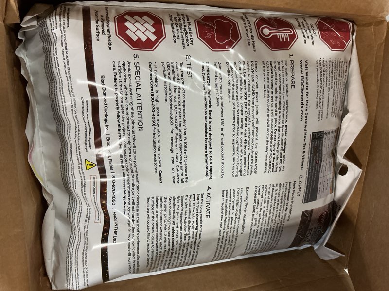 Condition photo showing New/Like New for 40 pound charcoal gray dominator polymeric sand with revolutionary ceramic flex technology for stabilizing paver joints/gaps, 1/8” up to 4”, professional grade results
