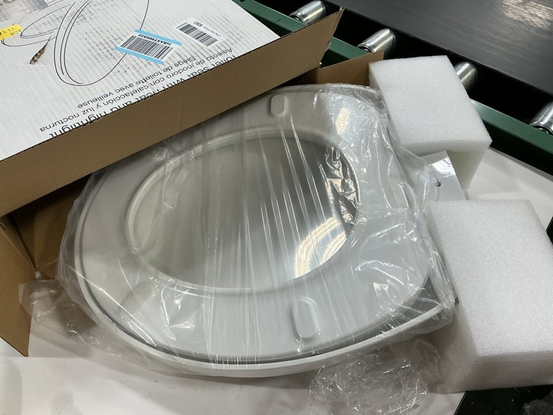 Condition photo showing As Is for KOHLER K-10515-0 PureWarmth Heated Quiet-Close Round-Front, Soft Close Toilet Seat for Standard Toilets, Slow Close, White Round White