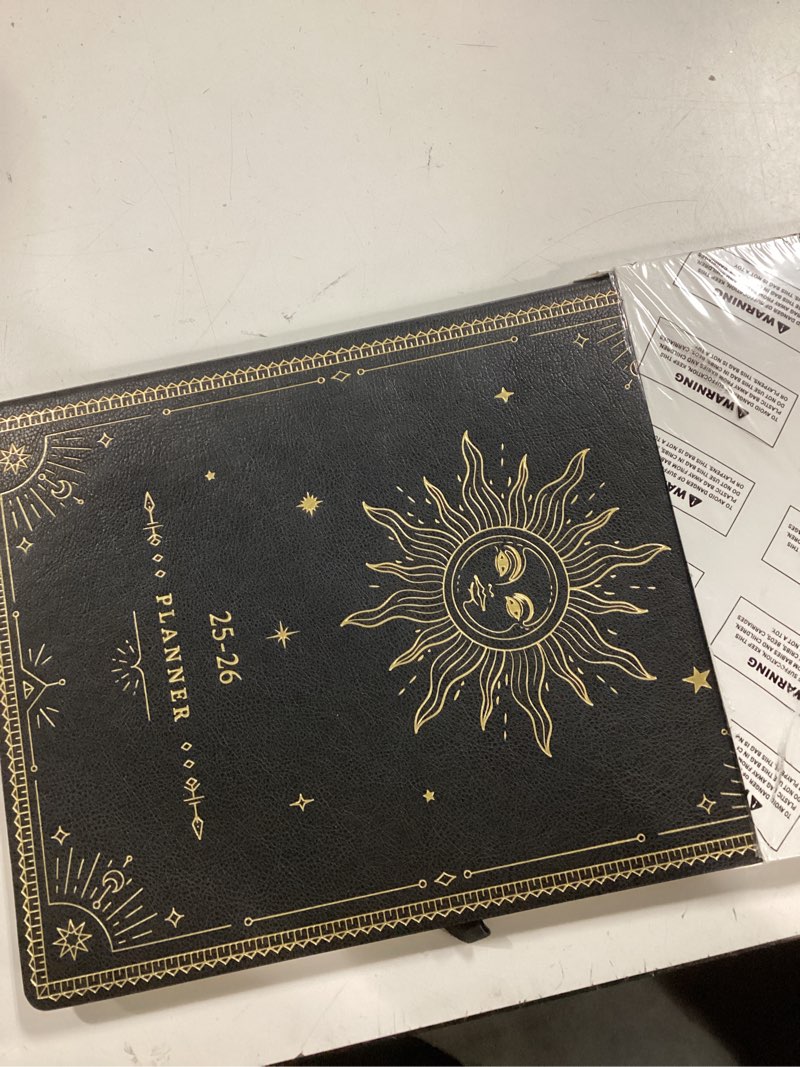 Condition photo showing New/Like New for 2026 Planner - Large 2026 Weekly Monthly Planner, 8.5" x 11", Jan. 2026 - Dec. 2026, Leather Cover with Thick Paper, Back Pocket, Box and Notes Pages - The Sun Large Black Sun