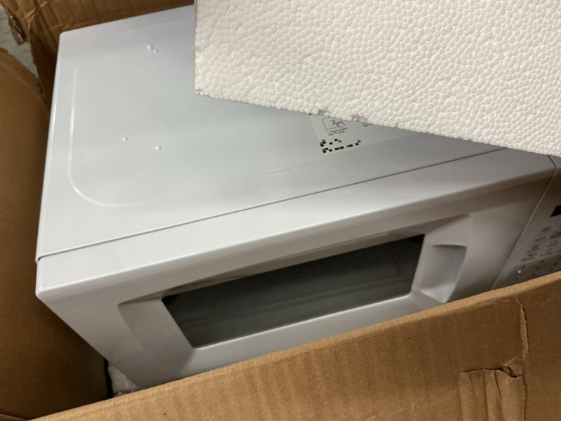 Condition photo showing As Is for COMFEE' EM720CPL-PM Countertop Microwave Oven with Sound On/Off, ECO Mode and Easy One-Touch Buttons, 0.7 Cu Ft/700W, Pearl White 0.7 Cu.Ft Classic White