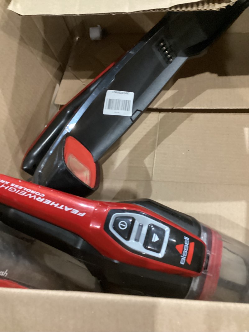 Condition photo showing As Is for bissell featherweight cordless xrt 14.4v stick vacuum, 3079 black/red