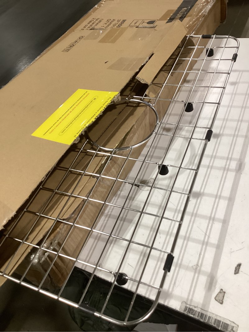 Condition photo showing item condition for serene valley sink bottom grid 24-1/8" x 12-5/8", centered drain with corner radius 1-1/2", sink protector nlw2412c