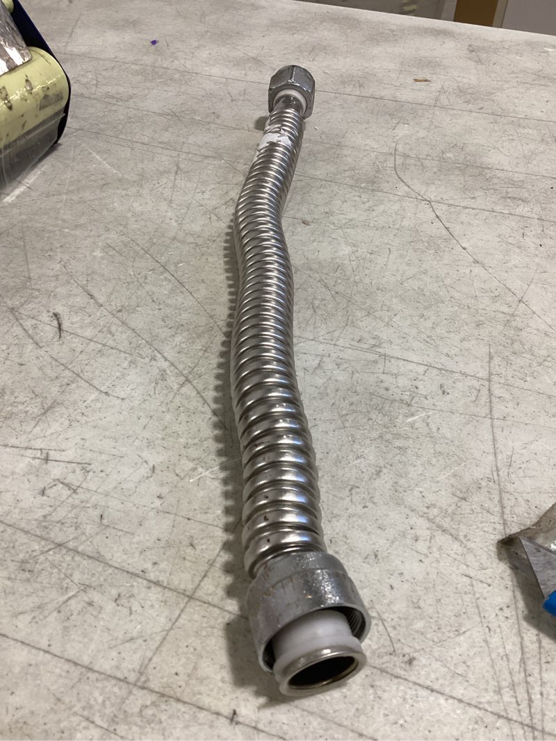 Condition photo showing As Is for charman manufacturing 24-in fip inlet x fip outlet corrugated stainless steel water heater