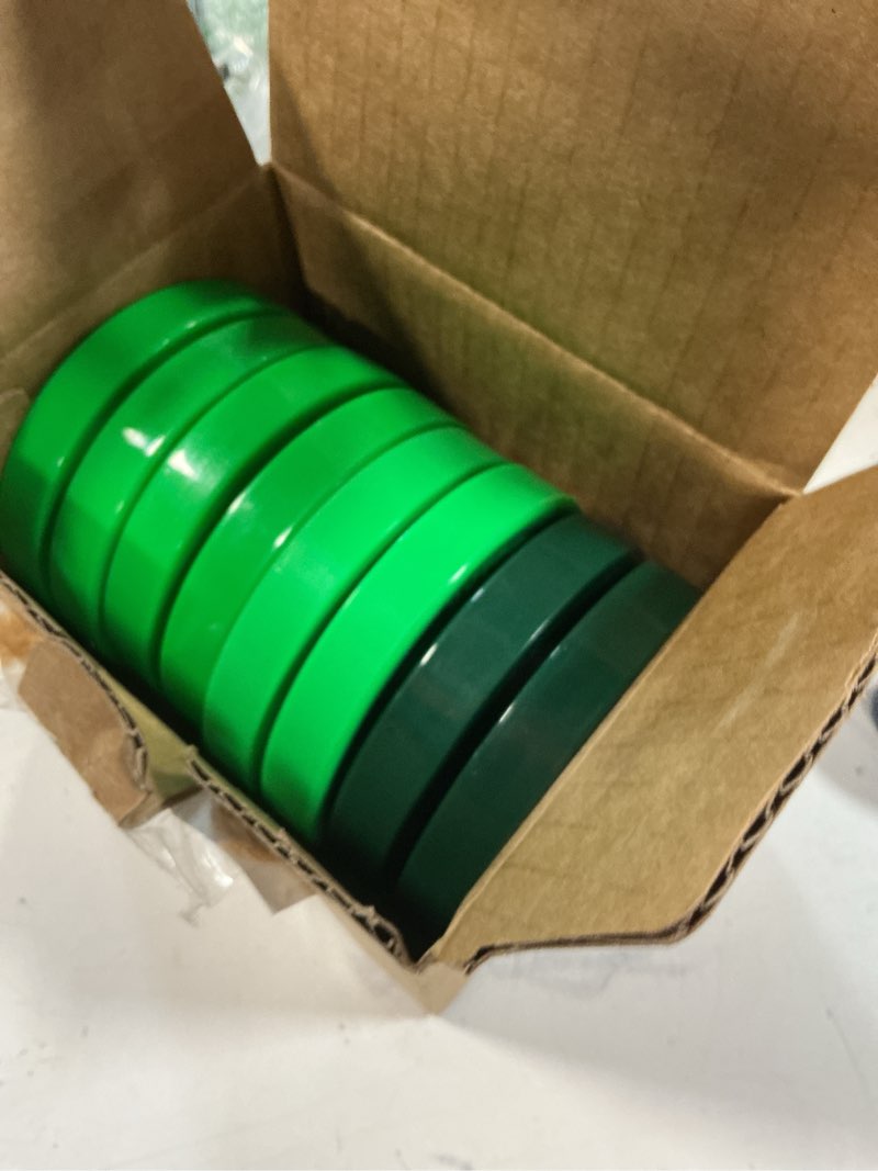 Condition photo showing New/Like New for better biscuit hockey pucks 4 pack - 3 passer & 1 shooter, green/dark green