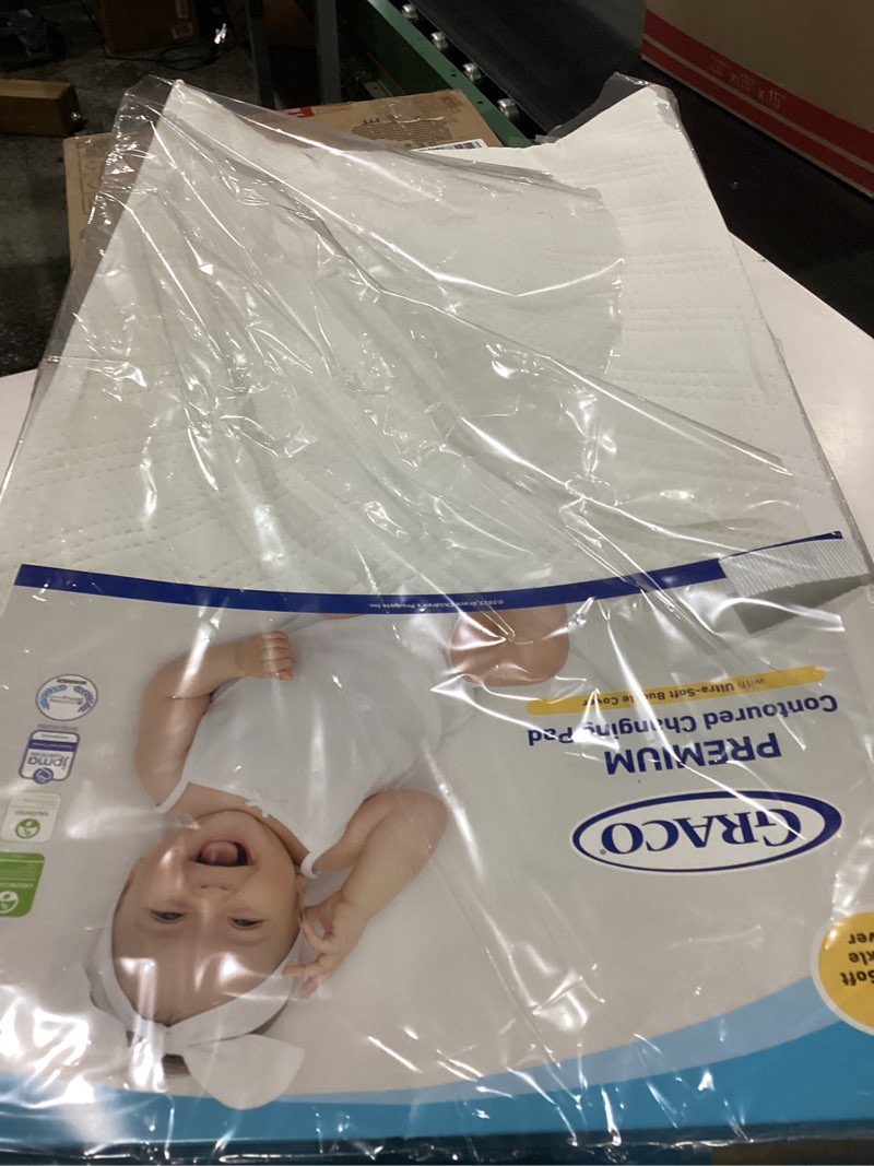 Condition photo showing Good Condition for Graco Premium Contoured Changing Pad – GREENGUARD Gold Certified, Water-Resistant, Ultra-Soft Buckle Cover, Contoured Baby Changing Pad, Fits Most Standard-Size Changing Toppers, Non-Skid Bottom
