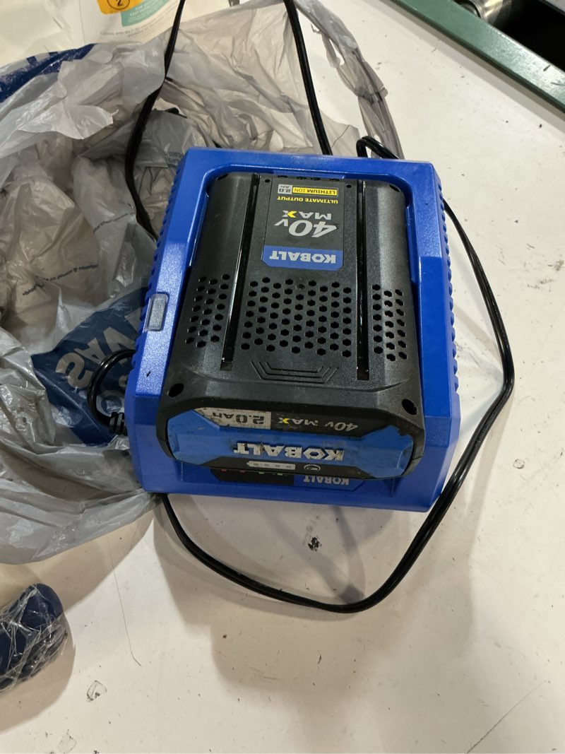 Condition photo showing As Is for kobalt 40 -volt, battery charger