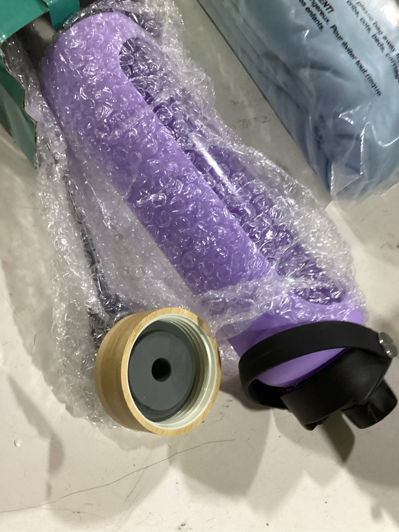Condition photo showing Good Condition for fulbevy 32 oz glass water bottles - 1 liter motivational tumbler water bottle time marker - borosilicate glass water bottle with silicone sleeve and 2 lids, handle spout & bamboo straw lid 32 ounces purple