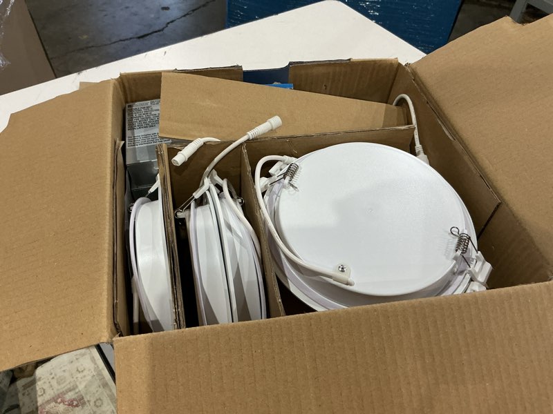 Condition photo showing As Is for utilitech white 6-in 850 -lumens warm white round dimmable led canless wet rated recessed downlight 12 -pack