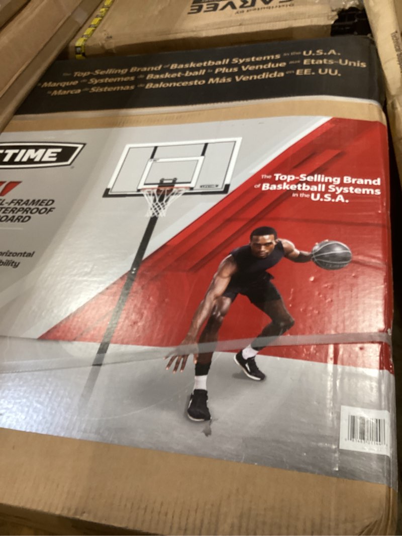Condition photo showing New/Like New for lifetime in-ground basketball hoop - 52 in polycarbonate, adjustable 7.5-10 ft