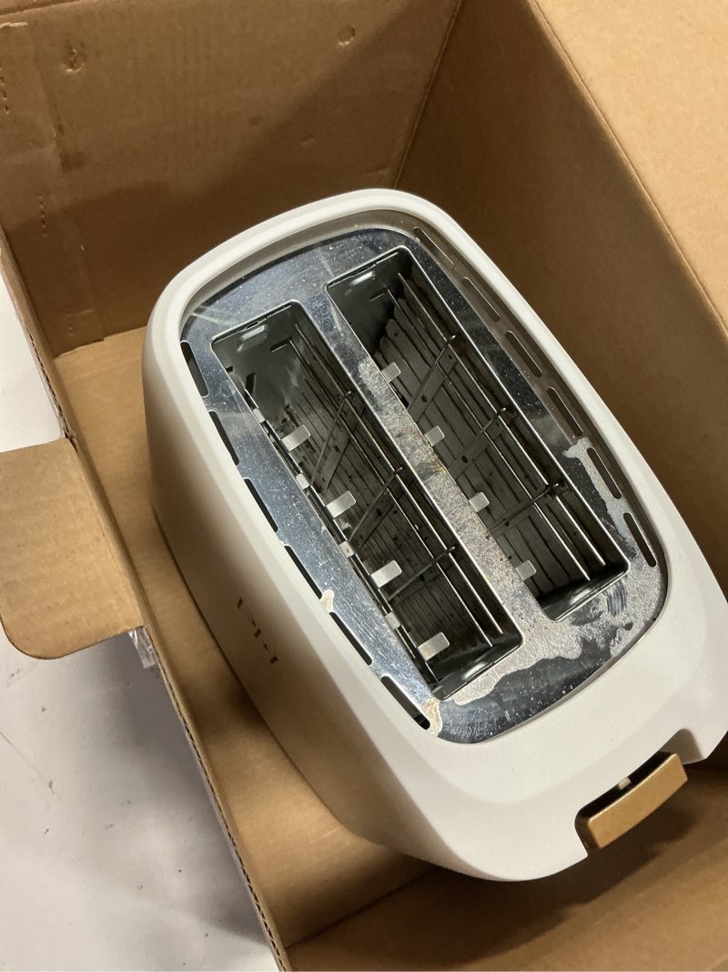Condition photo showing As Is for paris hilton 2-slice toaster, extra-wide slots, 7 browning settings, bagel & defrost functions, removable crumb tray, white 2-slice white