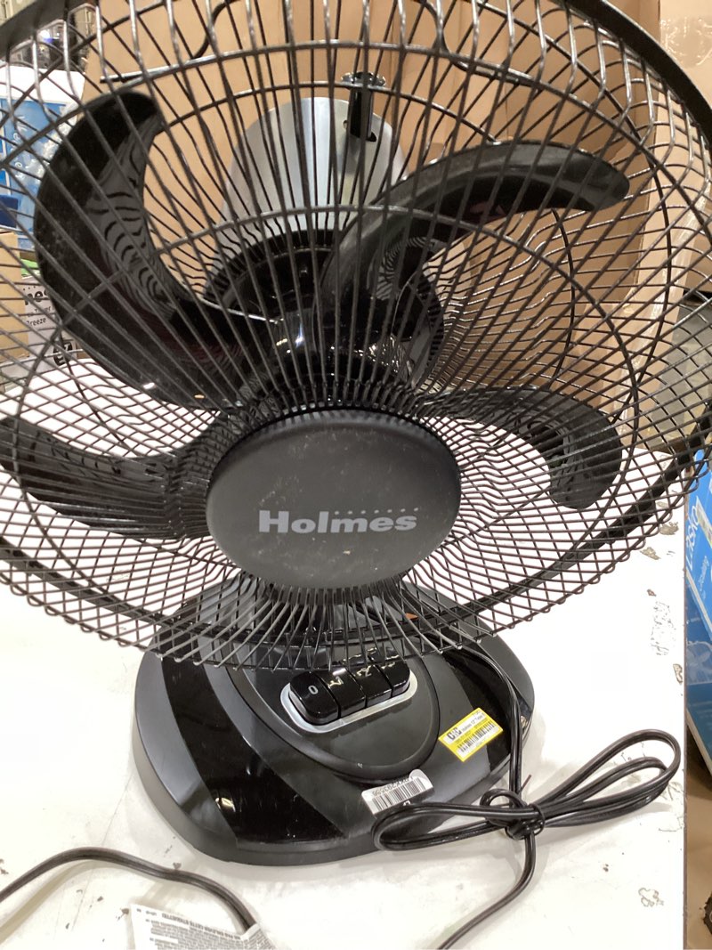 Condition photo showing As Is for 12" table breeze table oscillating fan black