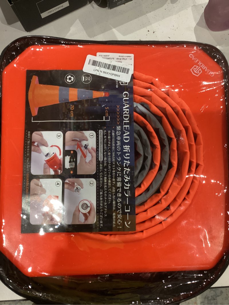 Condition photo showing As Is for 4 Pack 28 inch Collapsible Traffic Cones with LED Light, Safety Cones with Reflective Collars, Multi Purpose Pop Up Extendable Road Safety Cone by GUARDLEAD 28 inch 4