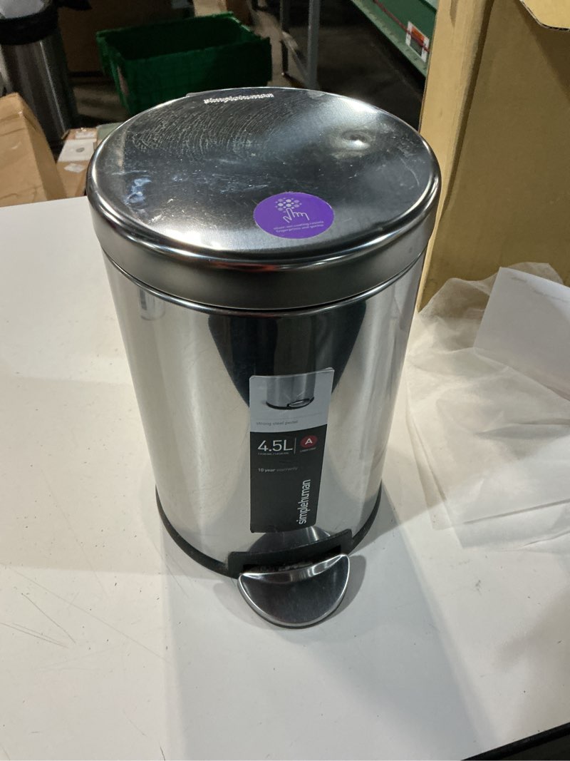 Condition photo showing As Is for simplehuman round step can, 4.5l / 1.2 gallon compact bathroom trash can, 150,000-step pedal, lid shox® silent close, removable inner bucket, brushed stainless steel brushed 4.5 liter / 1.2 gallon