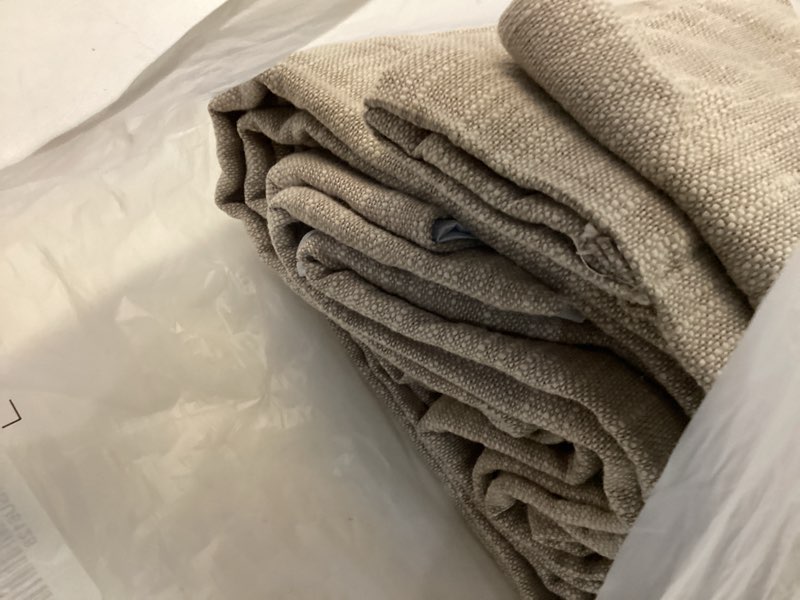 Condition photo showing As Is for taupe beige curtains