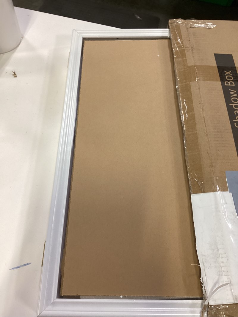 Condition photo showing Good Condition for 17x23 Shadow Box White Contemporary Frame - Interior Size 17x23 by 1 Inches Deep - White Frame is Made to Display Items Up to 1 Inches Deep Includes Shatter Resistant Acrylic, Backing, Hardware