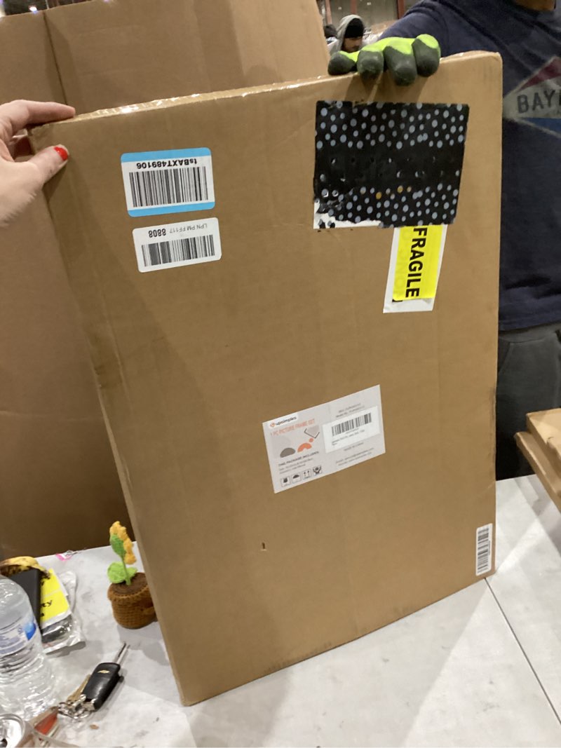 Condition photo showing New/Like New for upsimples 16x24 Picture Frame, Display Pictures 14x20 with Mat or 16 x 24 Without, Wall Hanging Poster Frames, Black, 1 Pack