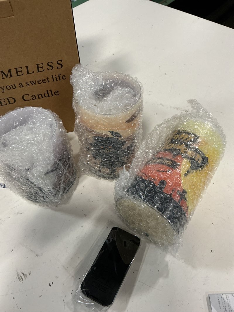 Condition photo showing New/Like New for set of 3 flameless led halloween themed candles with remote (patterns may vary)