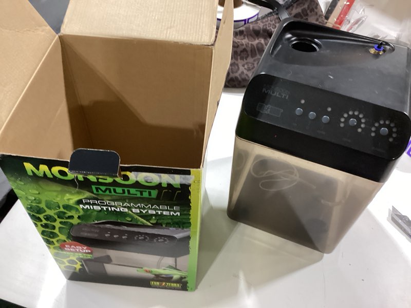 Condition photo showing As Is for exo terra monsoon multi ii reptile terrarium mister, black | programmable misting system with 4.5 bar pressure pump | flexible nozzles, leak-proof connectors | 8l (2 gallon) reservoir