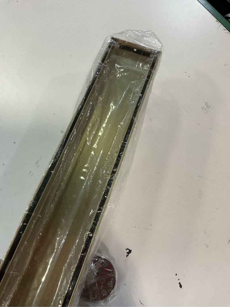 Condition photo showing Good Condition for linear shower drain ?with tile insert panels ?32 inch brushed gold 304 stainless steel rectangle shower floor drain?with hair catcher, adjustable feet 32inch brushed gold