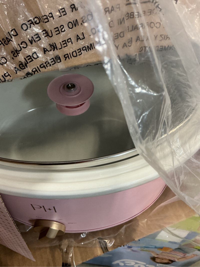 Condition photo showing New/Like New for paris hilton 6-quart manual slow cooker, features three settings (low, high, warm), naturally nonstick and dishwasher safe stoneware insert, family sized capacity, pink 6 quarts pink