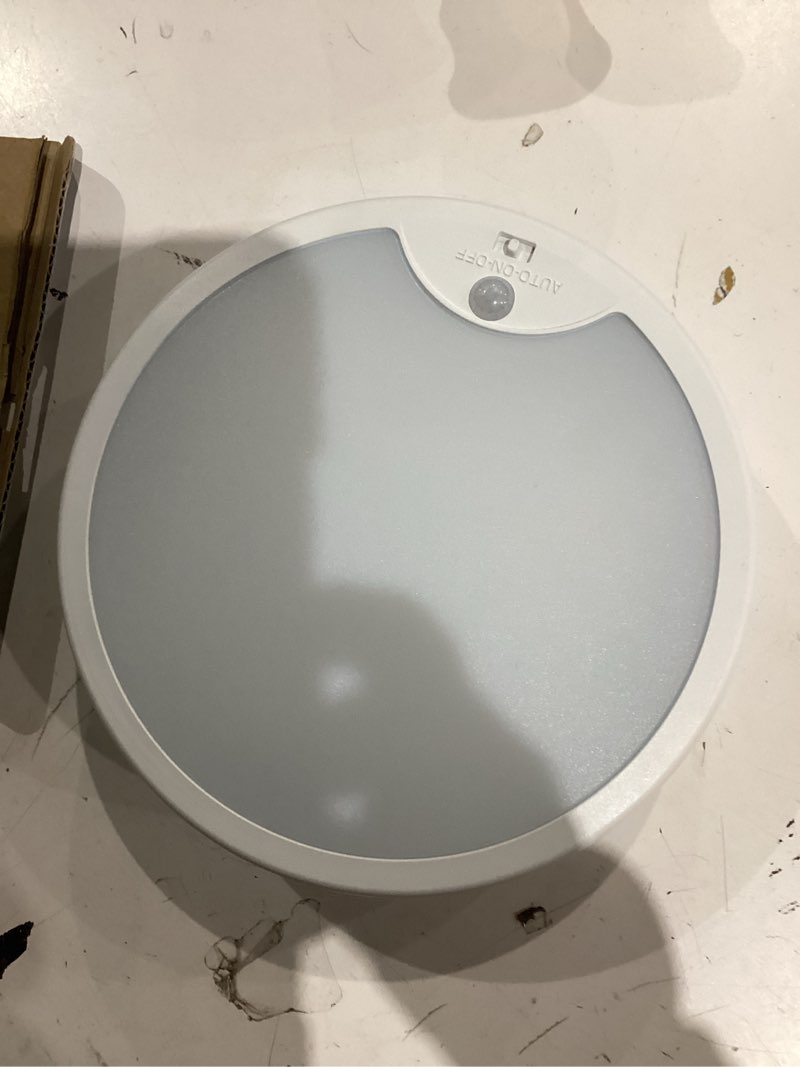Condition photo showing As Is for project source 1-light 7-in matte white led flush mount light with motion sensor