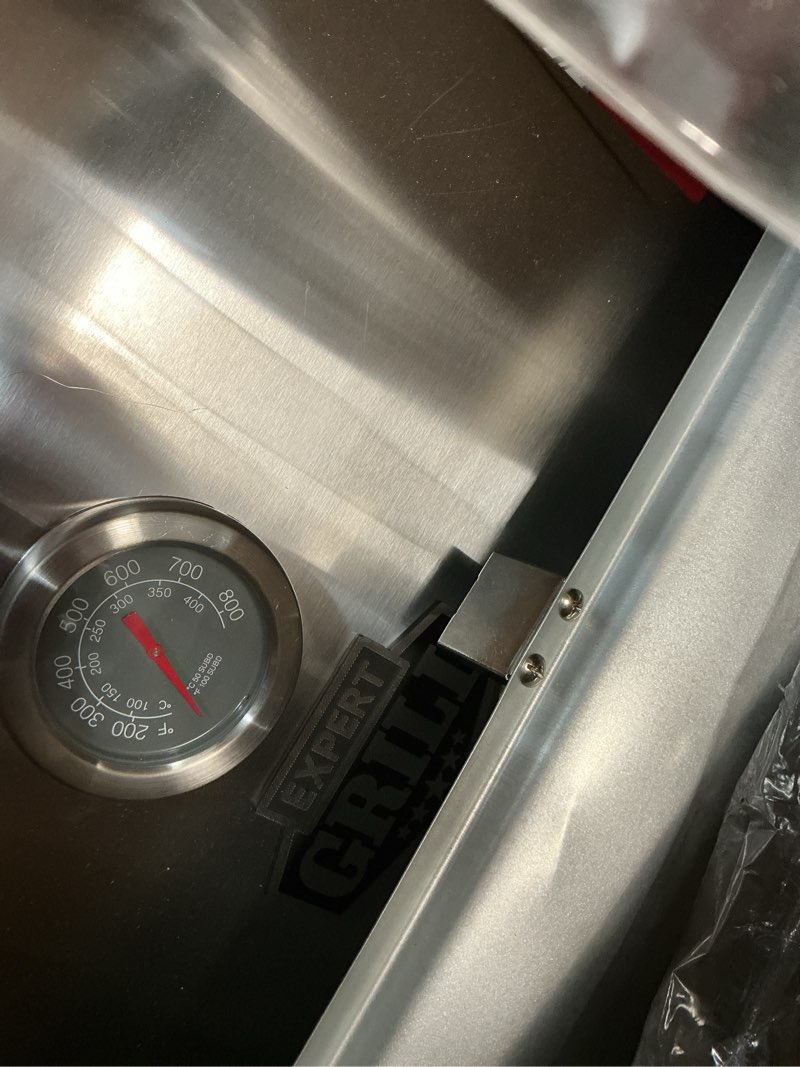Condition photo showing As Is for expert grill gas grill 4-burner propane gas grill with side table and wheels stainless steel