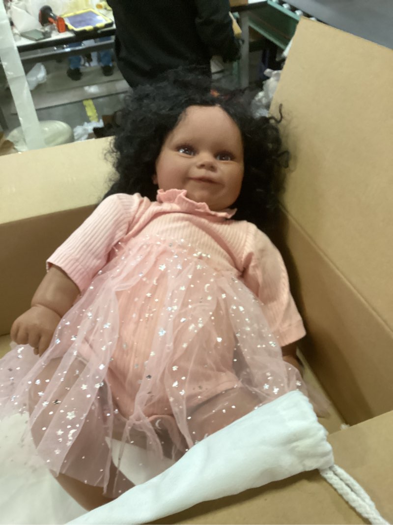 Condition photo showing Good Condition for Reborn baby doll with curly hair and brown eyes
