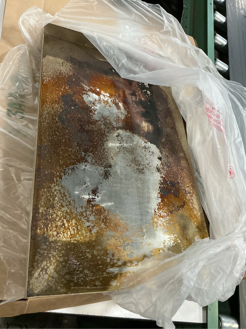Condition photo showing As Is for universal stainless steel griddle flat top plate with even heating bracing for bbq charcoal and gas grills, camping, tailgating, and parties,with grease groove and removable handles (23" x 16") 23" x 16" x 2.3"
