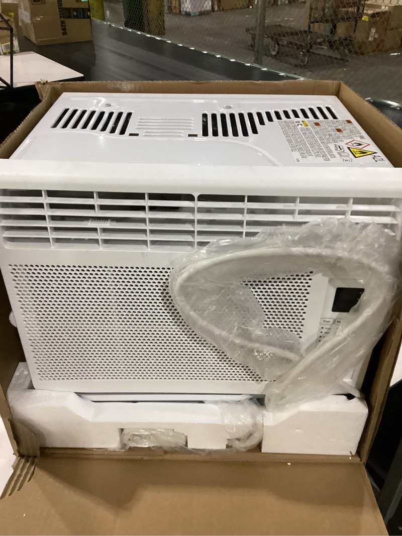 Condition photo showing As Is for not tested front cover cracked ge 6,000 btu electronic window air conditioner, cools rooms up to 250 sq ft, digital controls with remote, energy saver mode, 24hr timer, easy install kit included, white new 6,000 btu electronic controls white