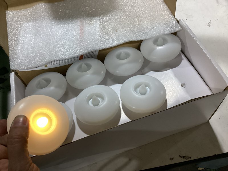 Condition photo showing Good Condition for homemory 24 pack 3” flameless led floating candles, 200 hour white battery operate waterproof tealights for cylinder vases, centerpieces at wedding decor, party, pool white base 24 pack