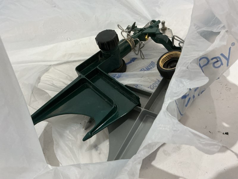 Condition photo showing As Is for orbit 2 -pack 6500-sq ft impulse spike lawn sprinkler
