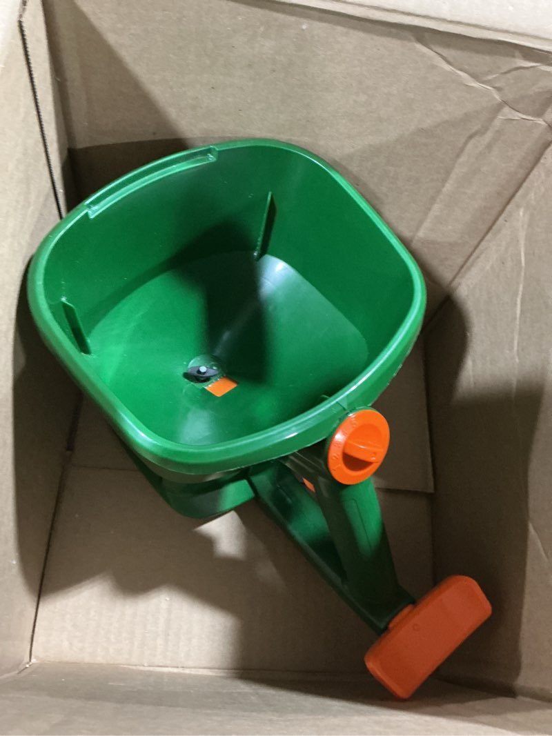 Condition photo showing As Is for Scotts Whirl Hand-Powered Spreader for Grass Seed, Fertilizer, Salt, Ice Melt, Handheld Spreader Holds up to 1,500 sq. ft. Product