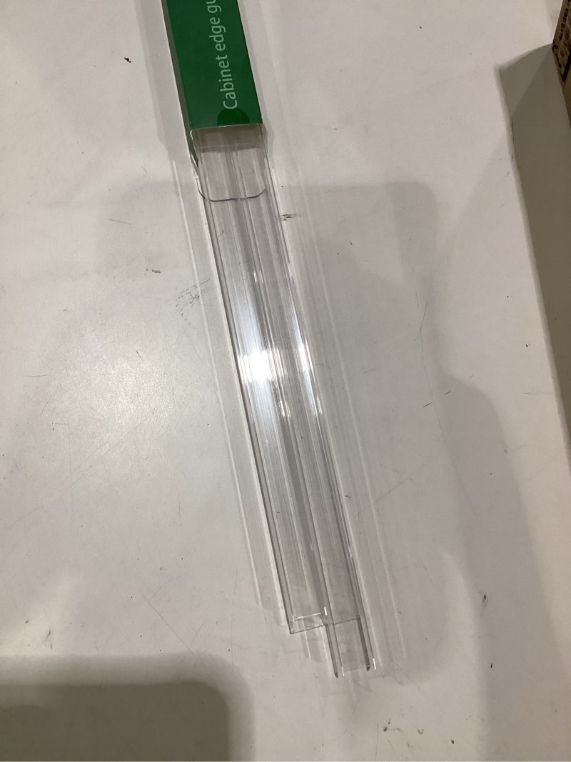 Condition photo showing As Is for 4pcs cabinet door protector, plastic edge protector trash drawer protector edge guard, slip on protectors for cabinets– 3/4" thick, 24" length, prevent wear, chipping, discoloration 24" length x 3/4" thickness - clear 4