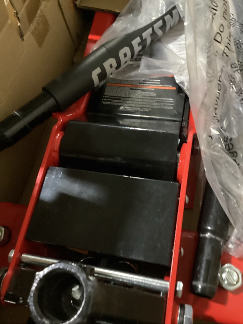 Condition photo showing As Is for craftsman red 2-ton steel hydraulic low profile floor jack