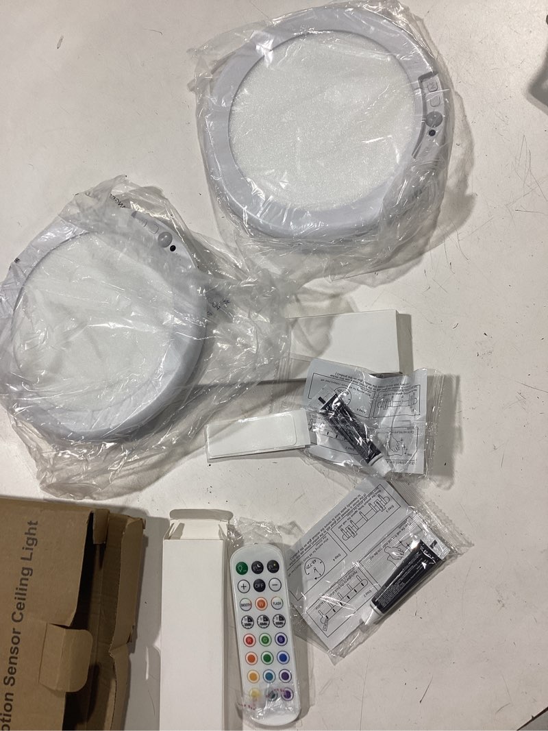Condition photo showing Good Condition for 2 pack rechargeable motion sensor ceiling light with remote, wireless battery operated closet light with 13 colors changing, 0.55? magnetic lights for shower bathroom closet hallway pantry 2 pack rgb color & white