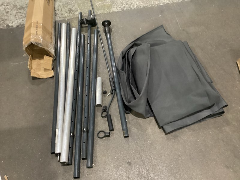 Large cloth. Poles. As is. No description. No builders manual 